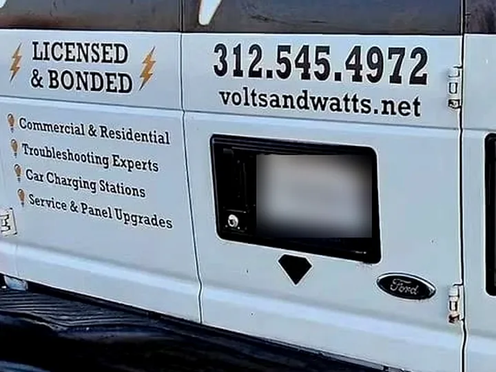 Close-up of the van's rear door: Licensed & Bonded, Commercial & Residential, Troubleshooting Experts, Car Charging Stations, Service & Panel Upgrades